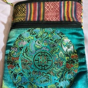 Small purse over shoulder. Green + stripe design